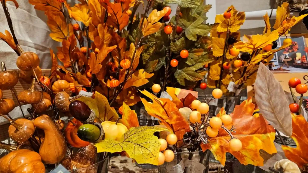 Japanese fall decor with autumn branches, pumpkins and berries